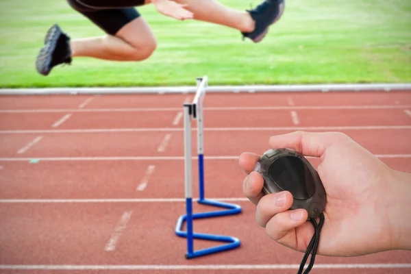 Coach bedrijf stopwatch tegen assertief — Stockfoto