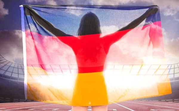 Atleta posando com bandeira alemã após a vitória — Fotografia de Stock