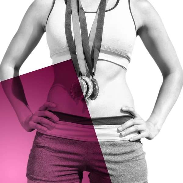 Mulher desportiva peito segurando medalhas — Fotografia de Stock