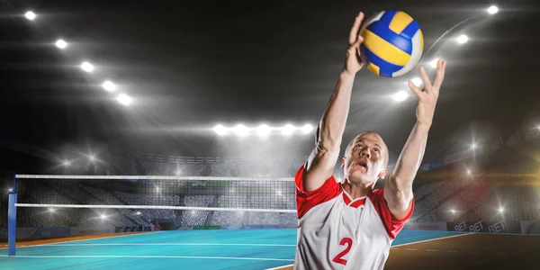 Sportsman catching volleyball — Stock Photo, Image