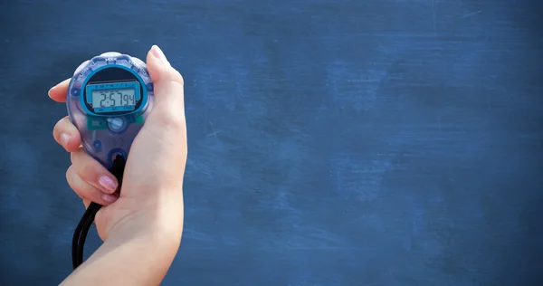 Woman holding chronometer to measure performance — Stock Photo, Image