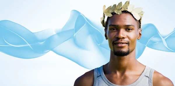 Victorious sportsman with crown of laurels — Stock Photo, Image