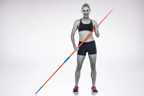 Athlete standing with javelin — Stock Photo, Image