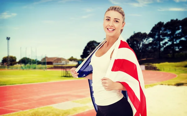 Atleet met Amerikaanse vlag op de schouders — Stockfoto