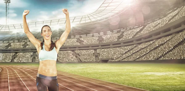 Sporty woman raising arms — Stock Photo, Image