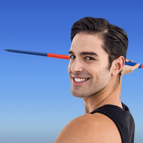 Feliz atleta masculino segurando dardo — Fotografia de Stock