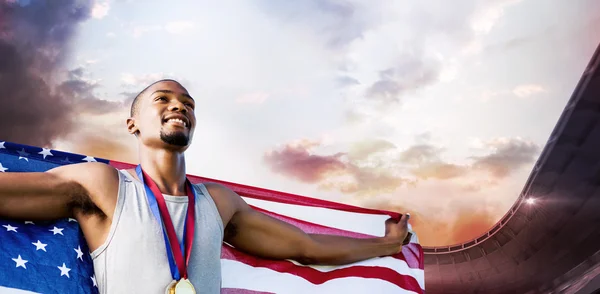 Desportista posando com bandeira americana — Fotografia de Stock
