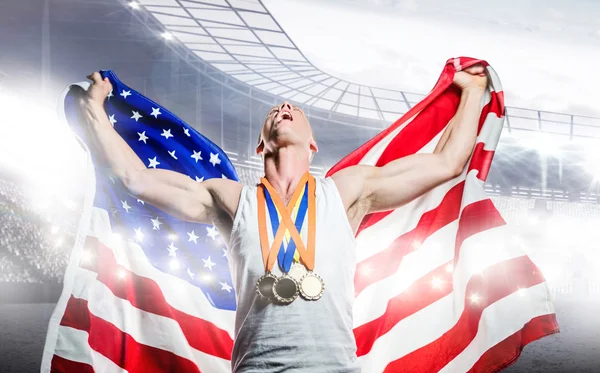 Athlet posiert mit amerikanischer Flagge — Stockfoto