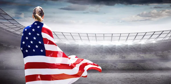 Sporty woman holding american flag — Stock Photo, Image