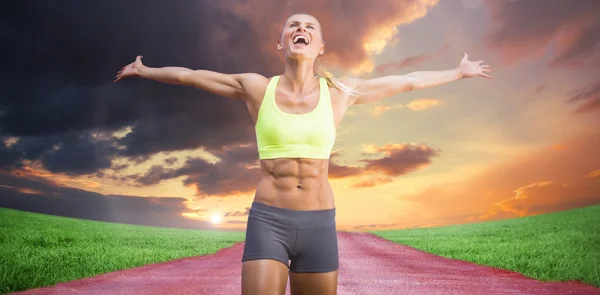 Woman celebrating victory with arms stretched — Stock Photo, Image