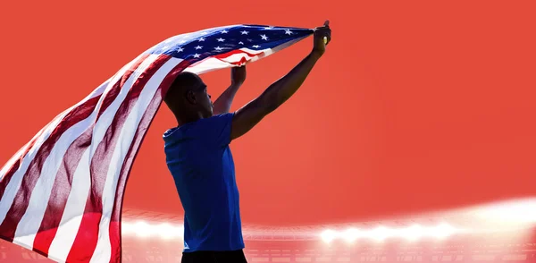 Deportista levantando bandera americana — Foto de Stock