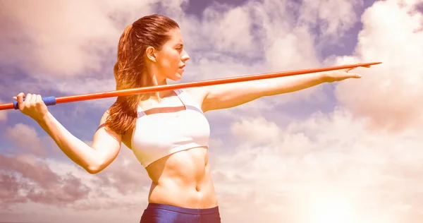 Sportswoman practising javel throw — Stock Photo, Image