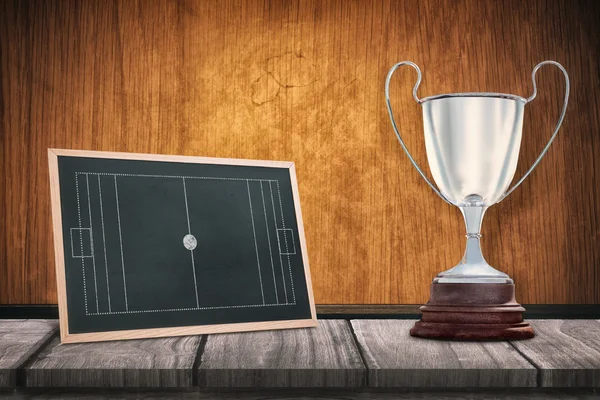 Trophy against black board — Stock Photo, Image