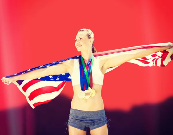Sportoló az érmek gazdaság amerikai zászló — Stock Fotó