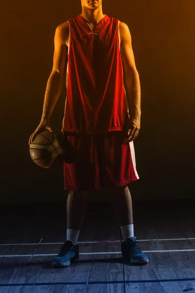 Basketball player holding ball — Stock Photo, Image