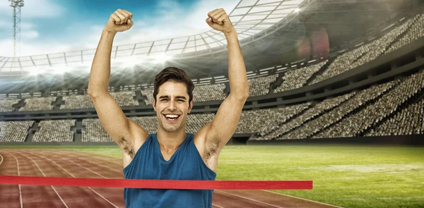 Winner athlete crossing finish line — Stock Photo, Image