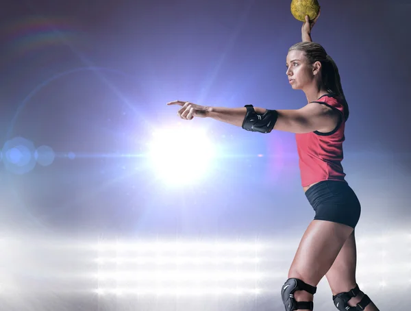 Athlete with elbow pads throwing handball — Stock Photo, Image