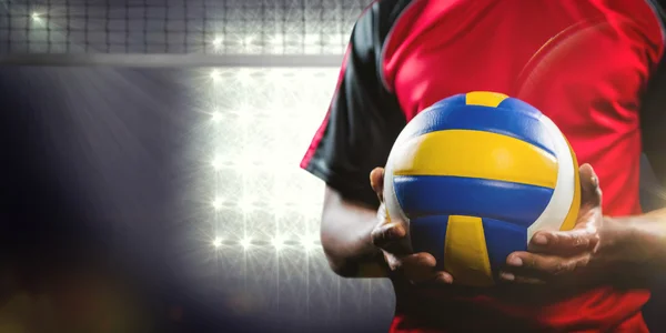 Sportsman holding volleyball — Stock Photo, Image