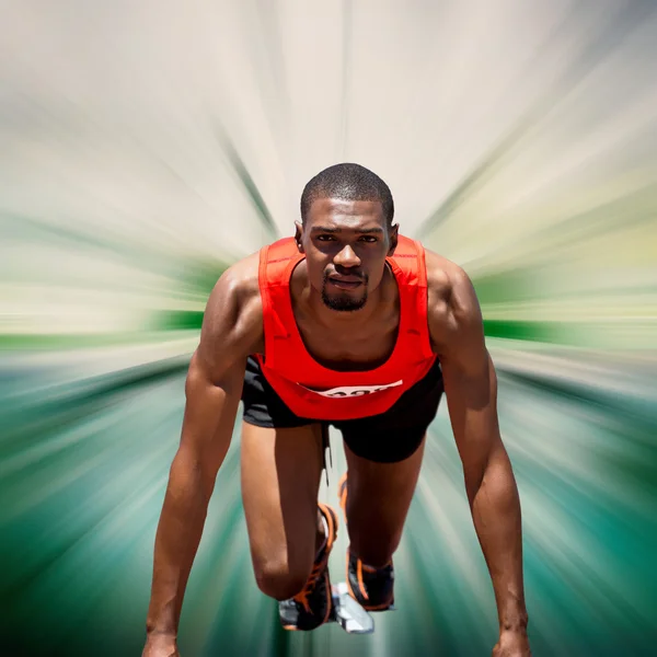 Muž sportovec v starting block — Stock fotografie