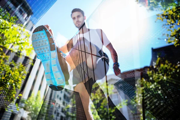 Handsome athlete running in street — Stock Photo, Image