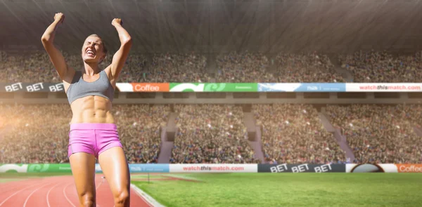 Sportswoman celebrating victory — Stock Photo, Image