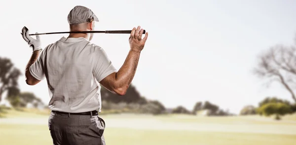 Golf player holding golf club — Stock Photo, Image