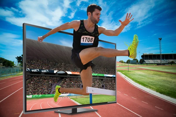 Athletic man practicing show jumping — Stock Photo, Image