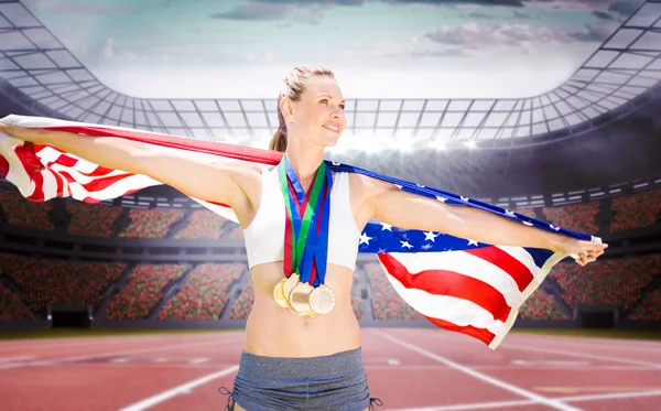 Щаслива спортсменка з медалями — стокове фото