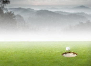 Golf ball at the edge of the hole clipart