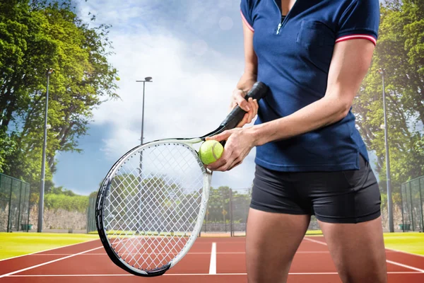 Tennis player holding a racquet ready to serve — Stock Photo, Image