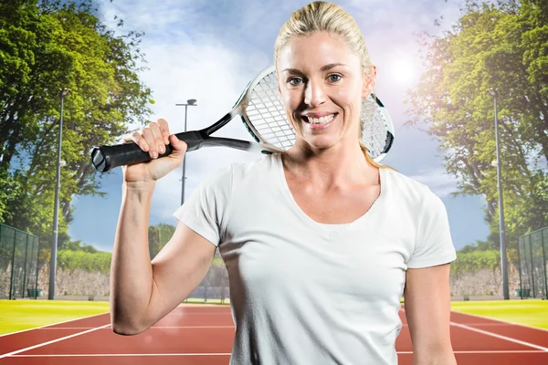 Female tennis player posing with racket — Stock Photo, Image