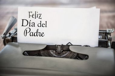 Feliz dia del padre written on paper clipart