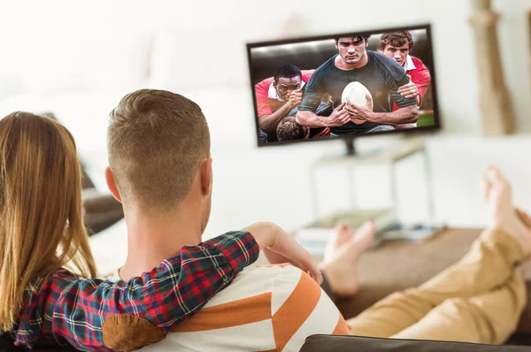 Cute couple relaxing on couch — Stock Photo, Image