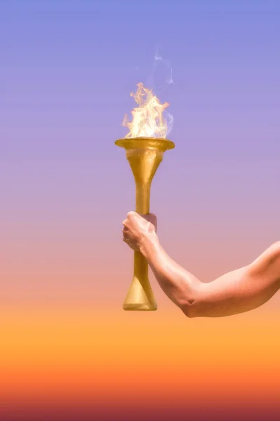 Sporty woman holding olympic torch — Stock Photo, Image