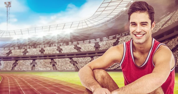 Happy athlete sitting — Stock Photo, Image