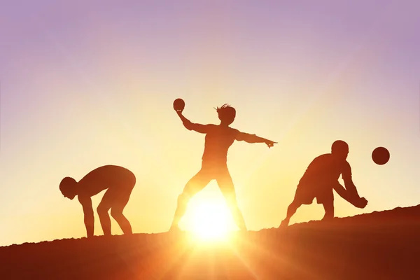 Silhouettes of sports people practicing — Stock Photo, Image