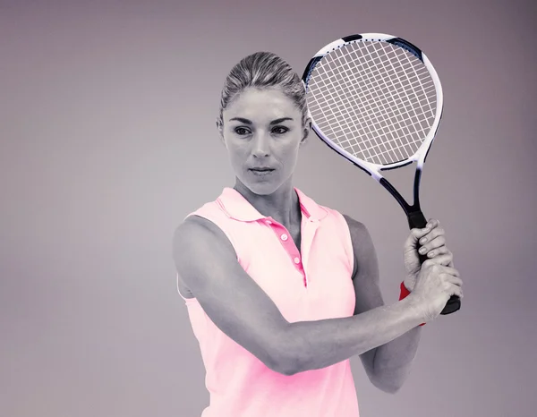 Atleta jugando al tenis con una raqueta —  Fotos de Stock