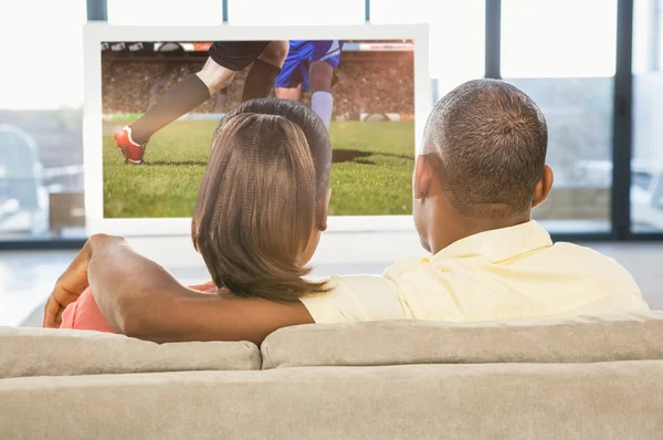 Casual couple watching tv Royalty Free Stock Images