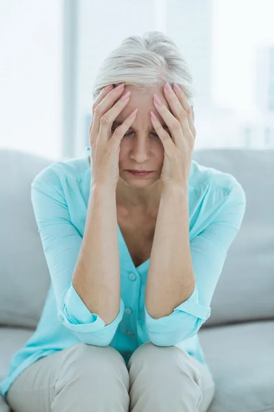 Senior woman suffering from headache — Stock Photo, Image