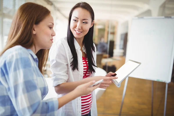 Female colleagues with tablet — Stock Photo, Image