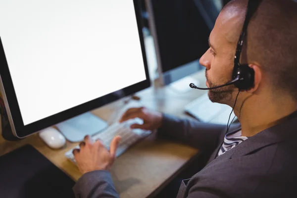 Businessman using headphones — Stock Photo, Image