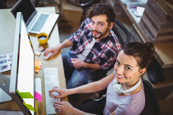 Coworkers working at computer desk — Stock Photo, Image