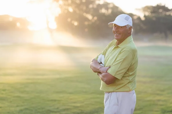 Happy golfer with arms crossed — Stock Photo, Image