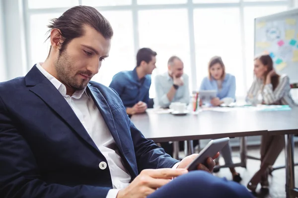 Confident businessman using tablet — Stock Photo, Image