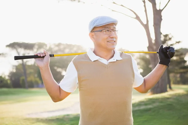 Deportista mirando hacia otro lado con su palo de golf —  Fotos de Stock