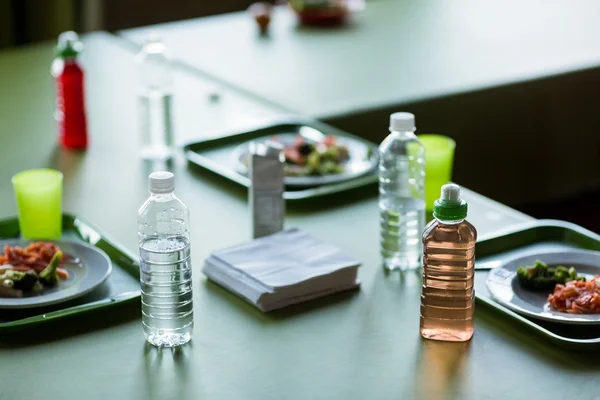 Food with water bottles on table — Stock Photo, Image