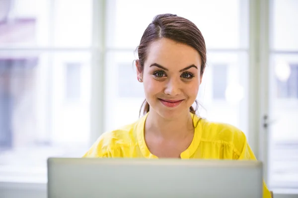 Businesswoman with laptop at office — Stock Photo, Image