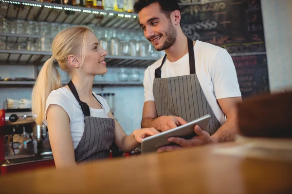 Colleagues discussing with tablet — Stock Photo, Image