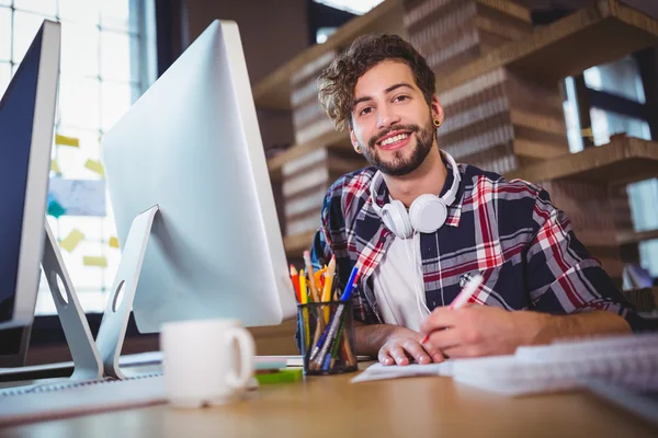 Creative businessman writing in book — Stock Photo, Image