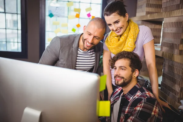 Business people looking at computer — Stock Photo, Image